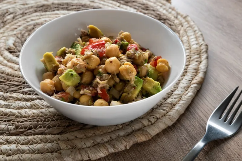 fresh chickpea salad with tuna, tomato, pepper, onion and avocado