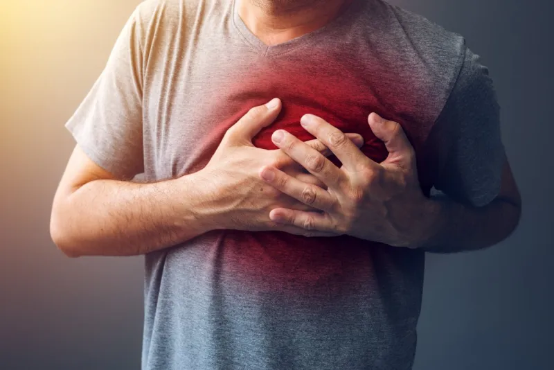 adult male with heart attack or heart burn condition, health and medicine concept