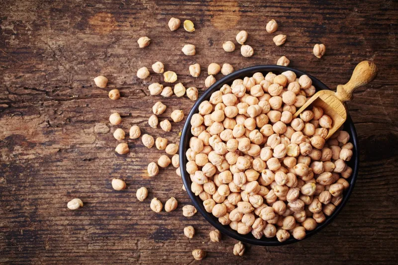 bowl of chickpeas on wooden background