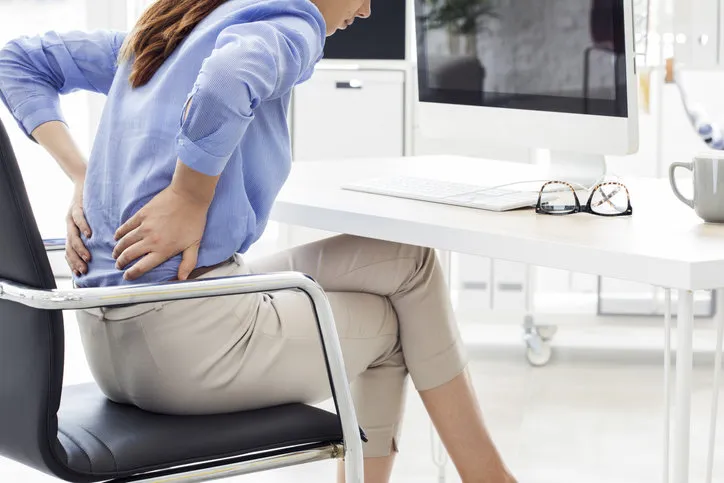 businesswoman with pain in back
