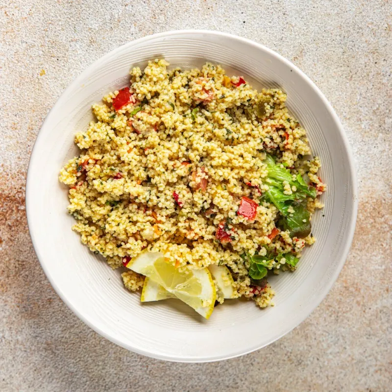 tabbouleh bulgur couscous with vegetables dish fresh delicious vegetarian and vegan food gourmet food background on the table rustic food top view copy space keto and paleo diet