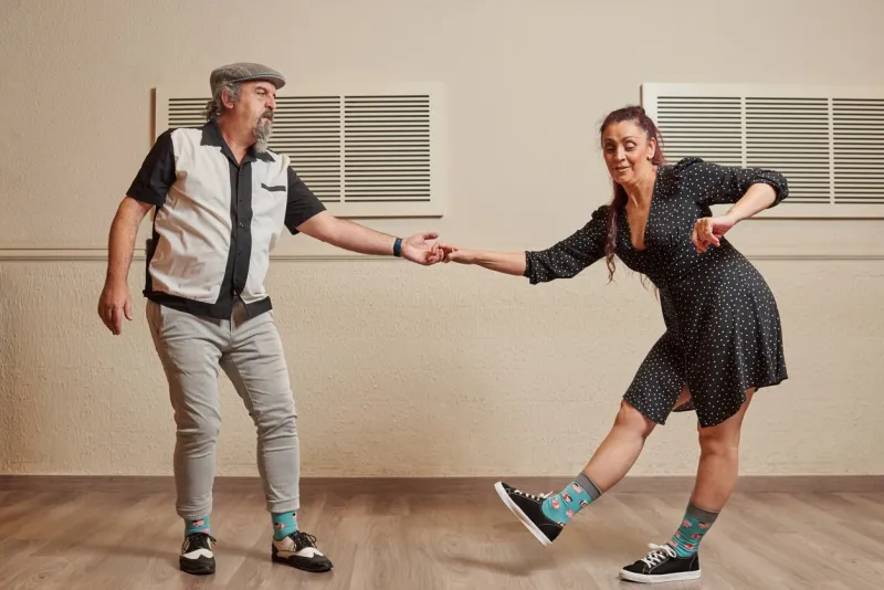 mature couple dancing lindy hop to improve coordination, balance, improve blood pressure and prevent joint pain