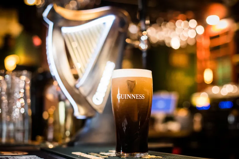 bucharest, romania - february 25, 2021  illustrative editorial close up image of a pint of guinness beer on a pub's counter