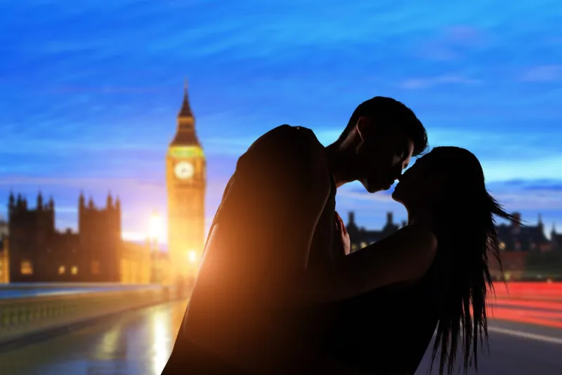 silhouette of couple is kissing with big ben