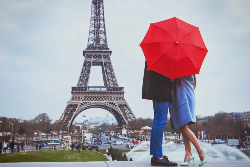romantic holidays for couple in paris, honeymoon vacation in france, europe, man and woman kissing near eiffel tower