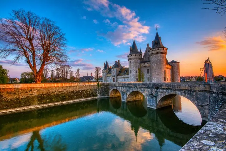 sully sur loire, france - april 13, 2019  famous medieval castle sully sur loire at sunset, loire valley, france the chateau of sully sur loire dates from the end of the 14th century