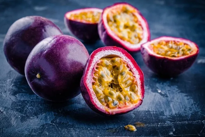 ripe organic passion fruit on dark background