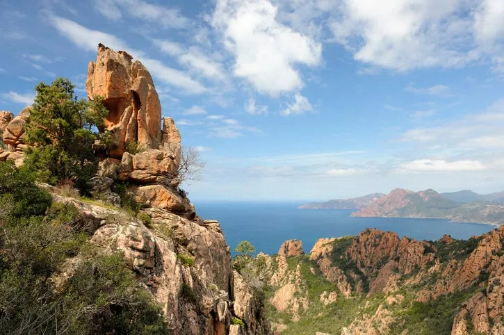 bizarre red rocks in the calanches above the gulf of porto location  island of corsica, france