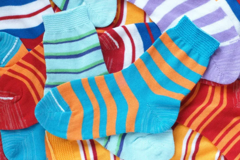 many pairs of child's striped socks, for backgrounds or textures