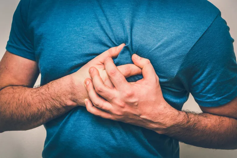 man having chest pain, heart attack - body pain concept