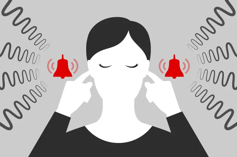 woman with closed eyes is plugging her ears with fingers when suffering from tinnitus red bells as symbol of unbearable ringing in ears concept of diseases of hearing organs or neurology problems