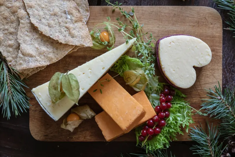 a cheese platter with typical christmas decorations