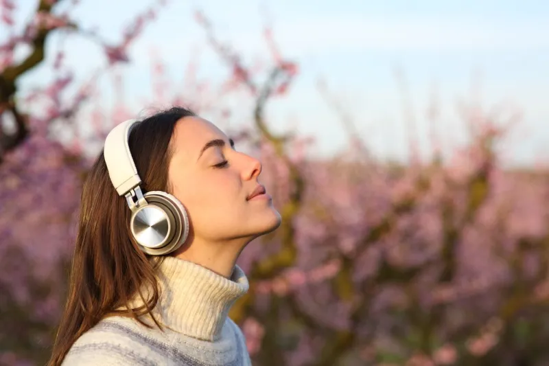 profile of a woman meditating listening audiobook with headphone