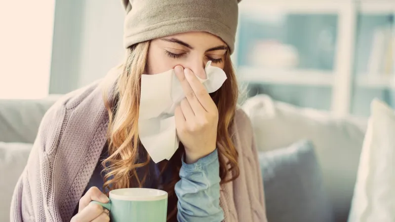 young woman suffering from cold