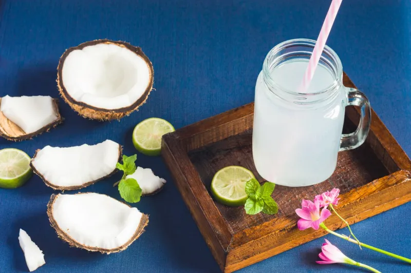 fresh organic coconut water in a jar food background