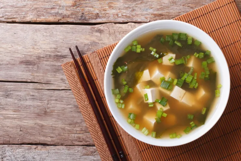 japanese miso soup in a white bowl on the table horizontal view from above