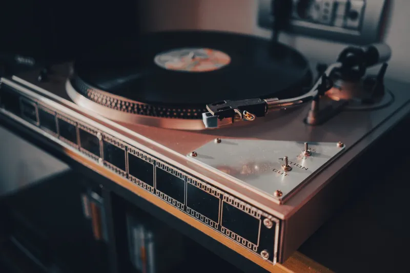 details of a modern record player on the table, an interesting light on the side