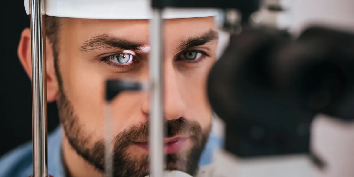 handsome young man is checking the eye vision in modern ophthalmology clinic patient in ophthalmology clinic