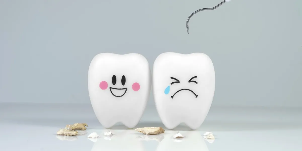 teeth smile and crying emotion with dental plaque tool ,concept dental care cleaning bacterial plaque