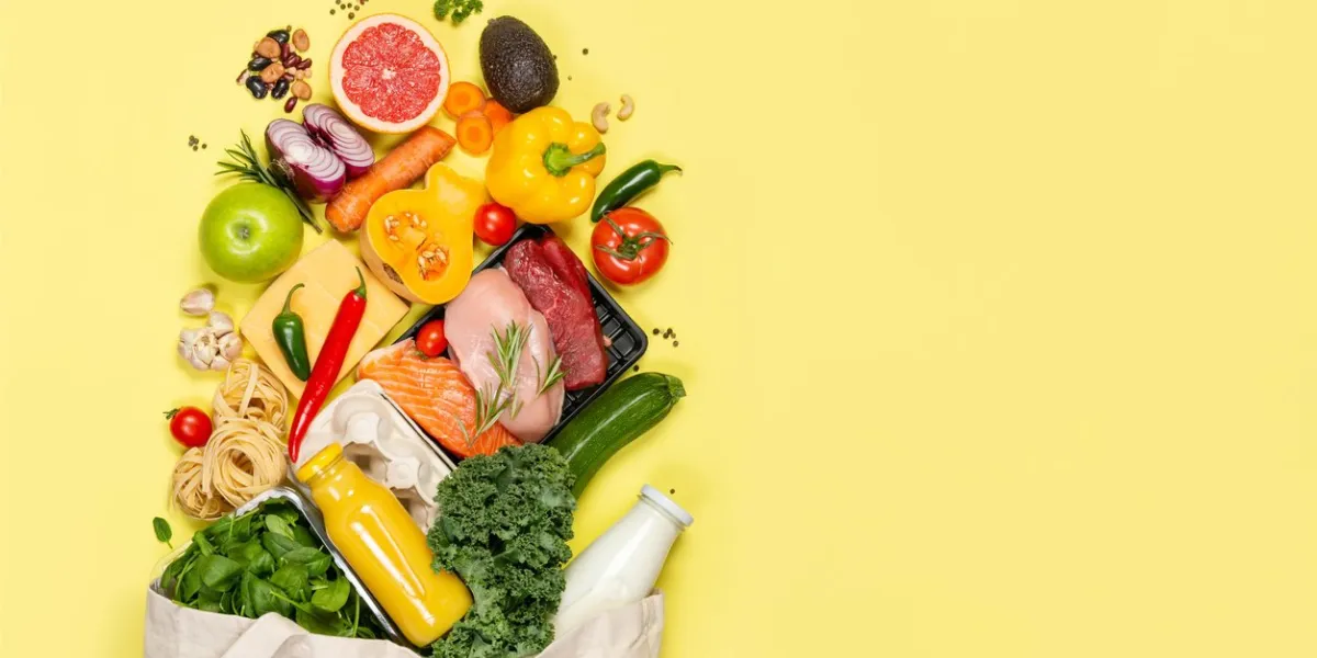 grocery shopping concept - meat, fish, fruits and vegetables with shopping bag, top view