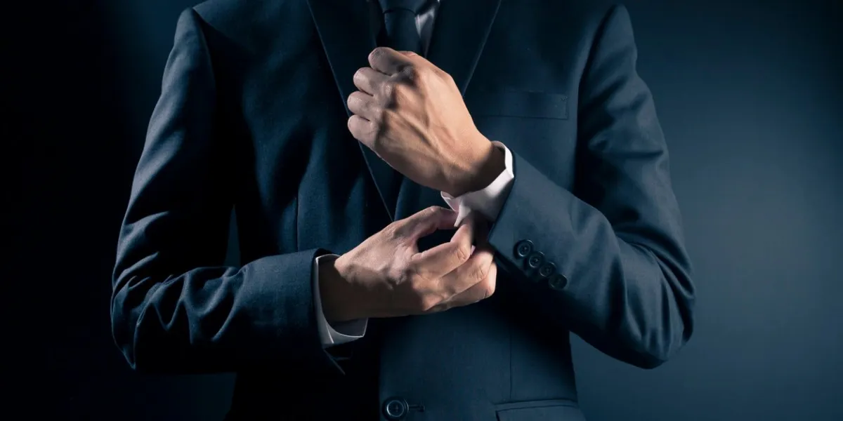 businessman fixing cufflinks his suit