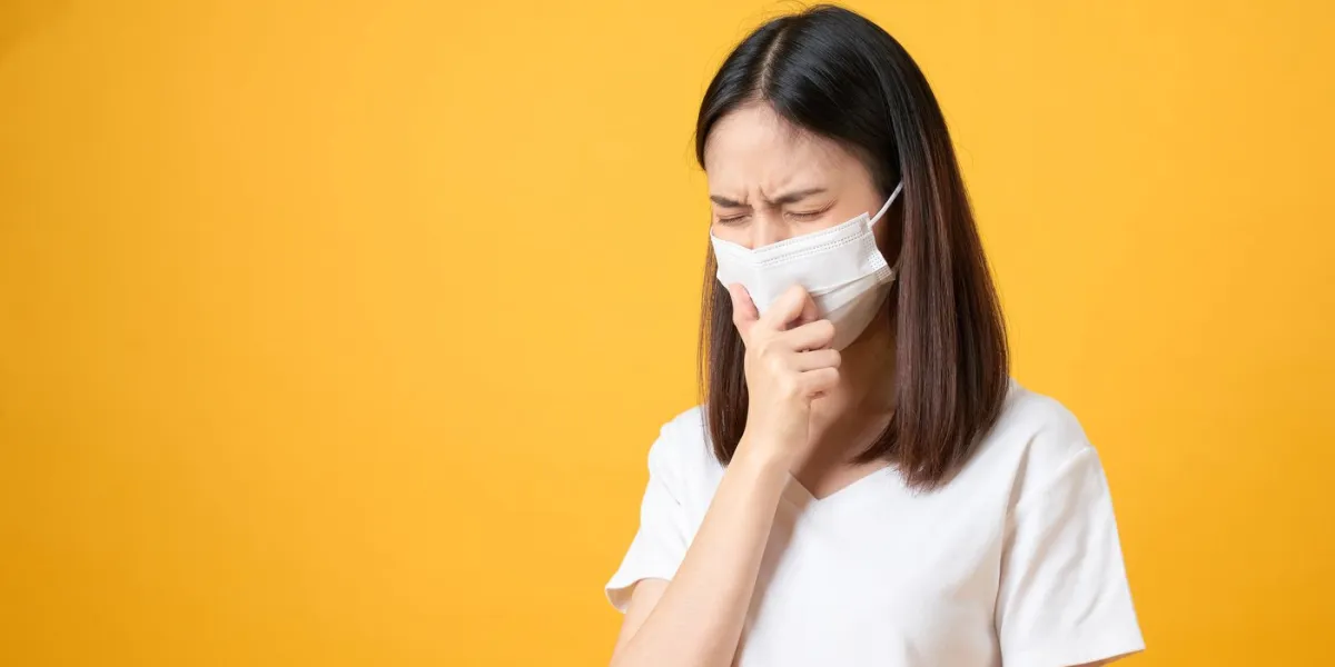 asian women wear masks to protect disease on orange background