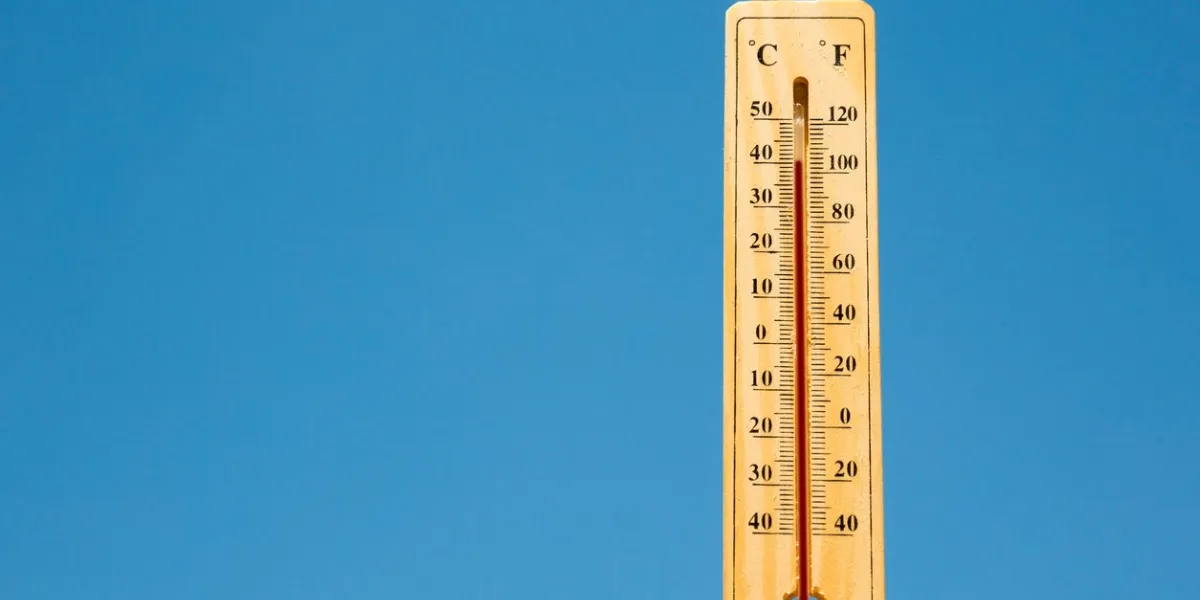 mercury thermometer marking 40 degrees celsius 100 fahrenheit in a sunny day summer heat shown on mercury thermometer against the blue sky