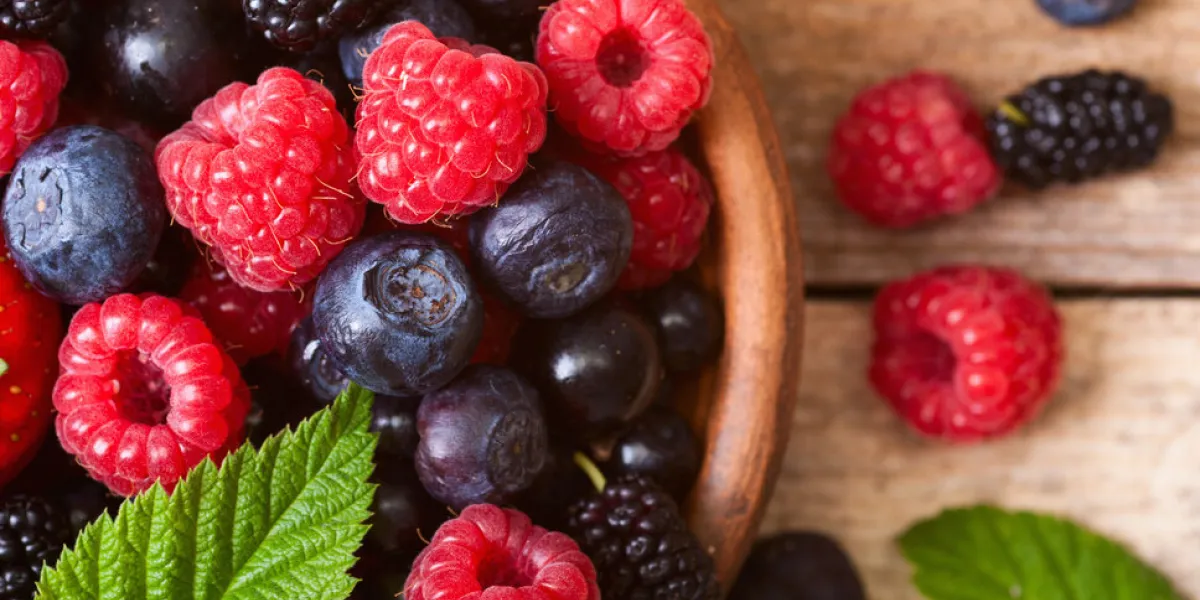 different fresh berries as background