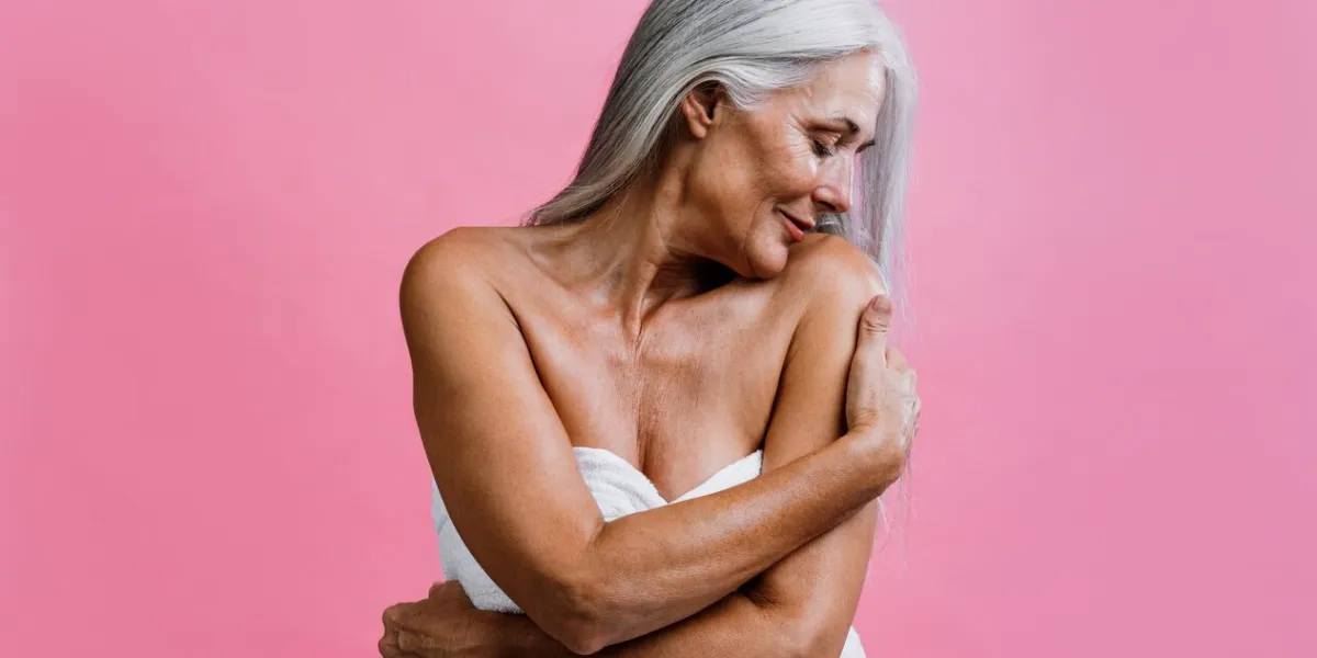 image of a beautiful senior woman posing on a beauty photo session middle aged woman on a colored background concept about body positivity, self esteem and body acceptance