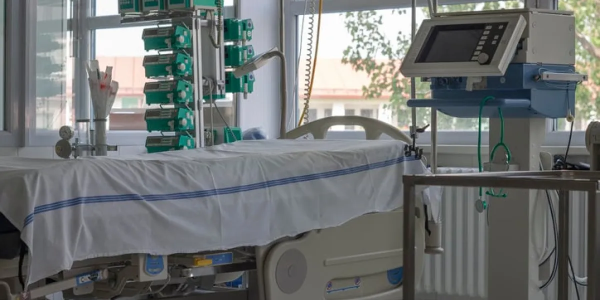 intensive care unit in hospital, bed with monitor, ventilator, a place where can be treated patients with pneumonia caused by coronavirus covid