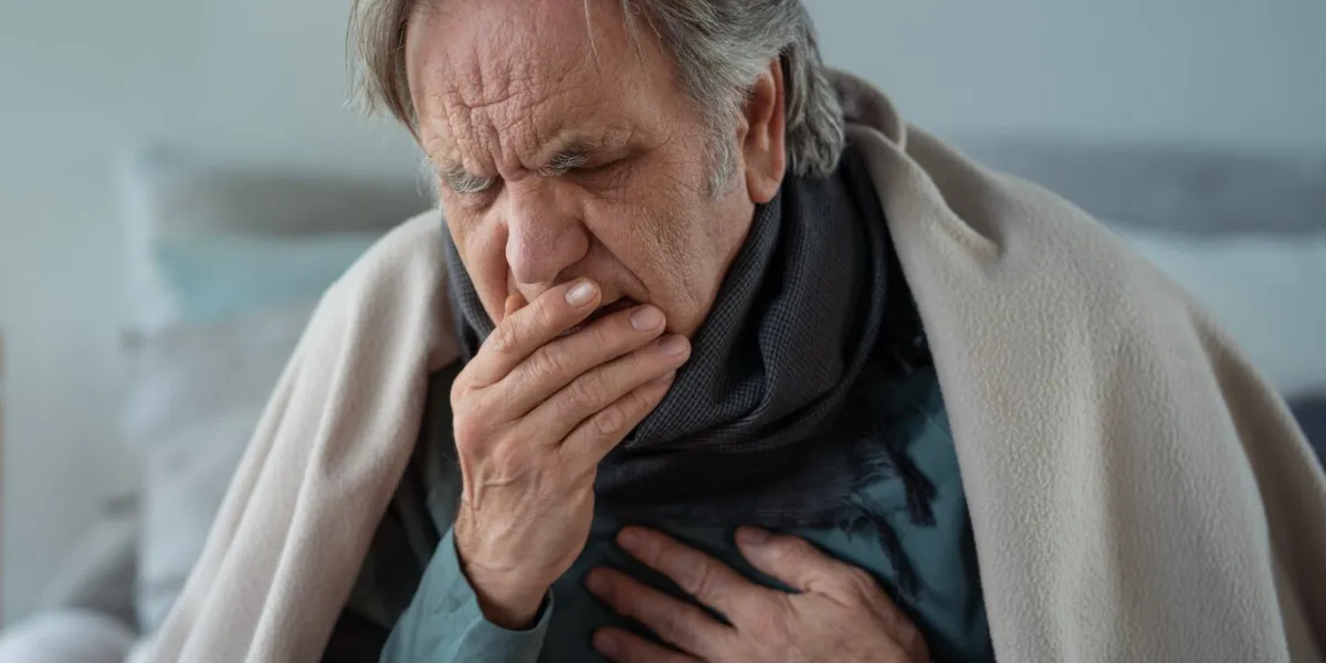 portrait of coughing old man