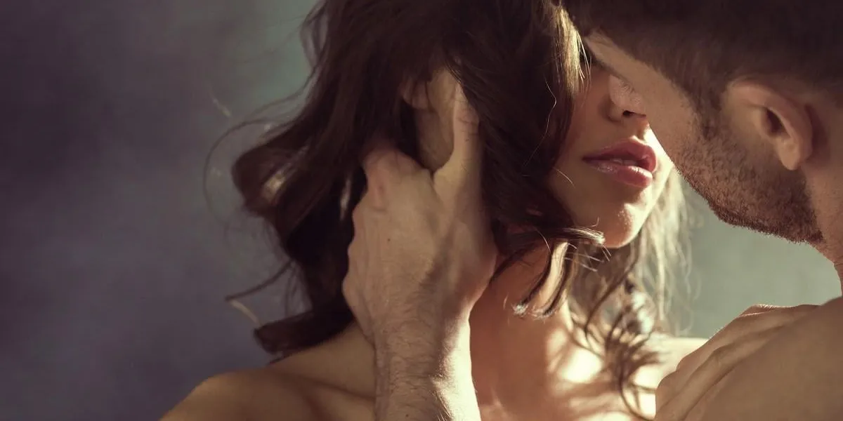 sensual woman kissing her handsome husband