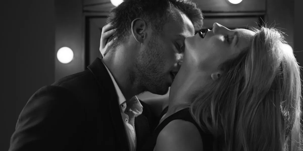 romantic excited elegant couple kissing and caressing