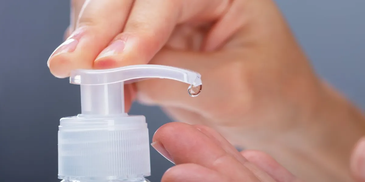 close-up of a woman using rubbing alcohol
