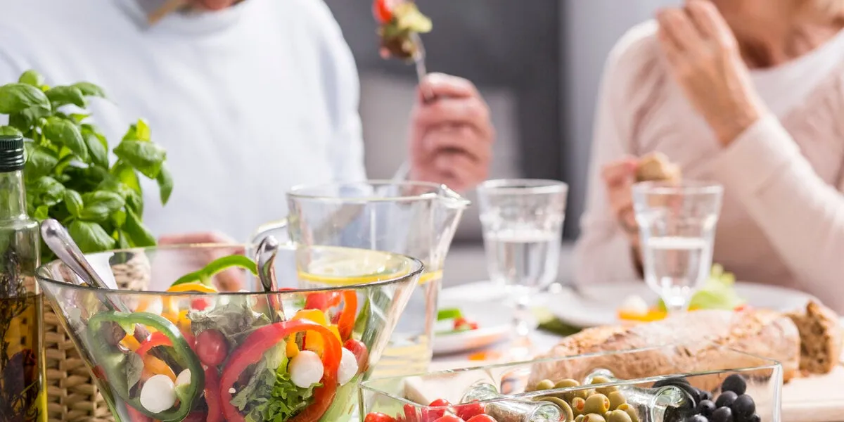 cropped picture of an elderly couple eating a healthy dinner