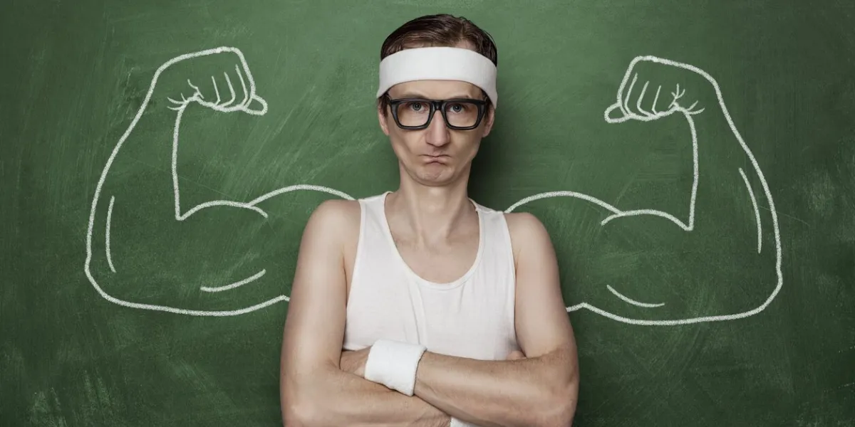 funny sports nerd flexing fake muscle drawn on the chalkboard