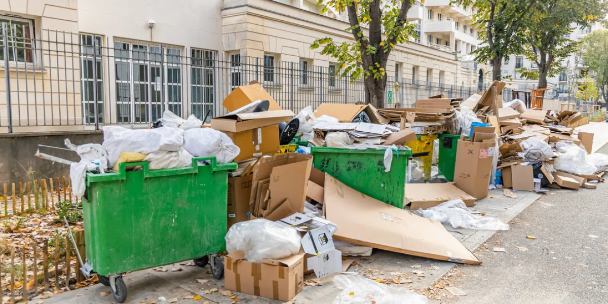full garbage bins during a waste collection service strike in pa