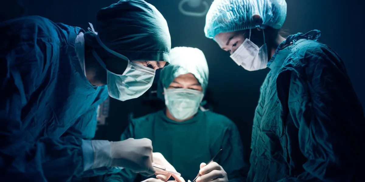 surgical team working on a patient in operating theater
