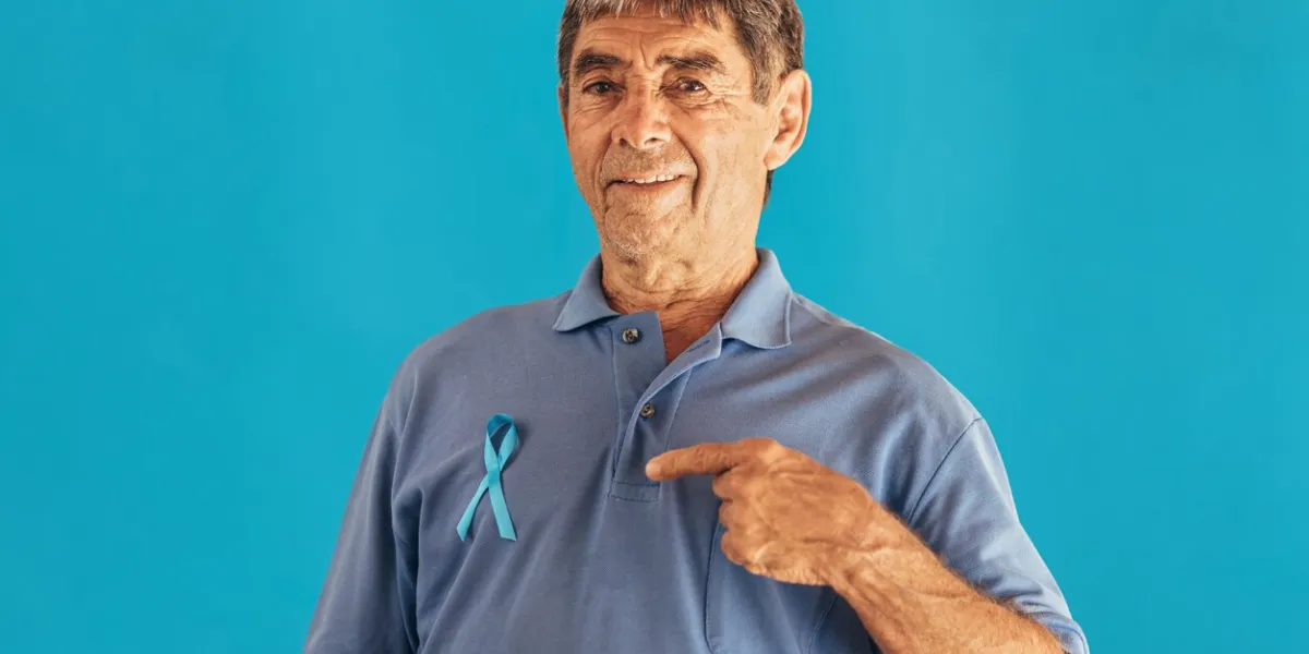 prostate cancer awareness man with light blue ribbon for supporting people living and illness men healthcare and world cancer day concept