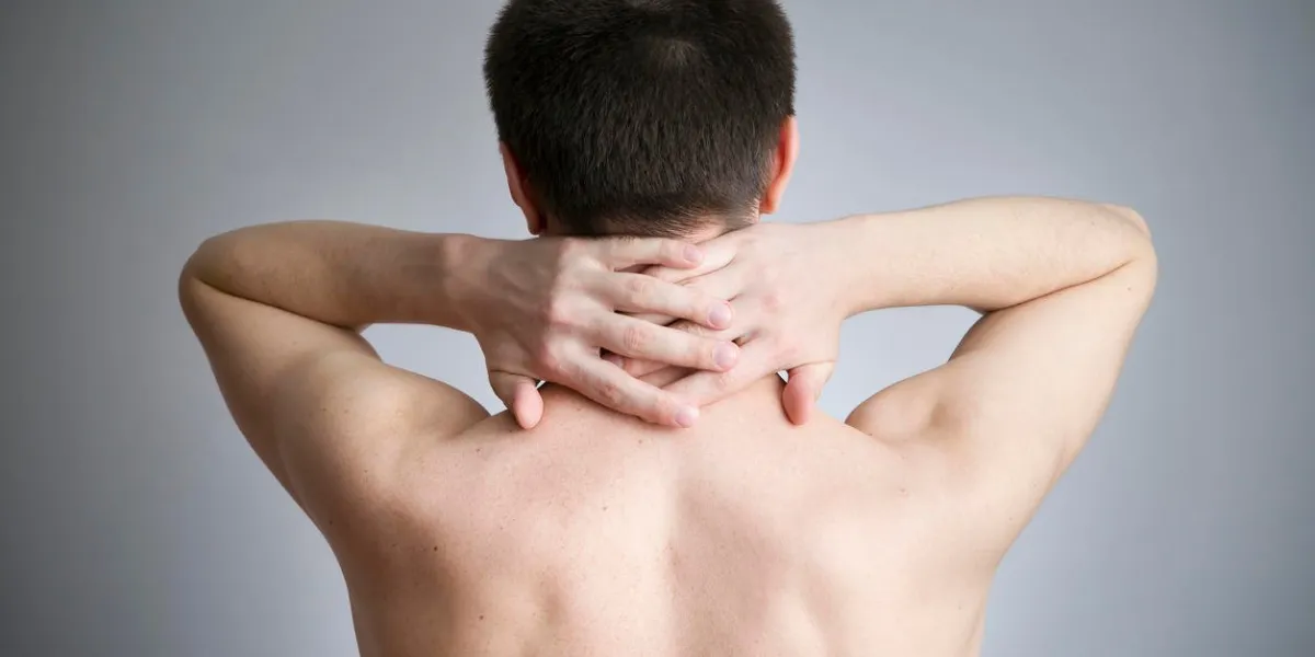 neck pain in men touching the body