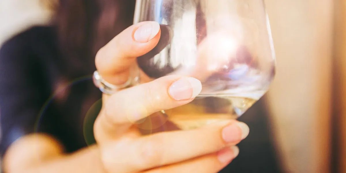 happy girl toasting white wine