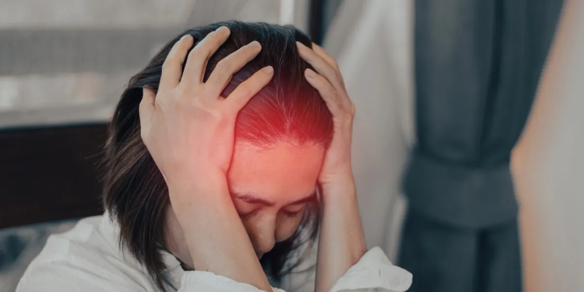 vertigo illness concept woman hands on her head felling headache dizzy sense of spinning dizziness,a problem with the inner ear, brain, or sensory nerve pathway