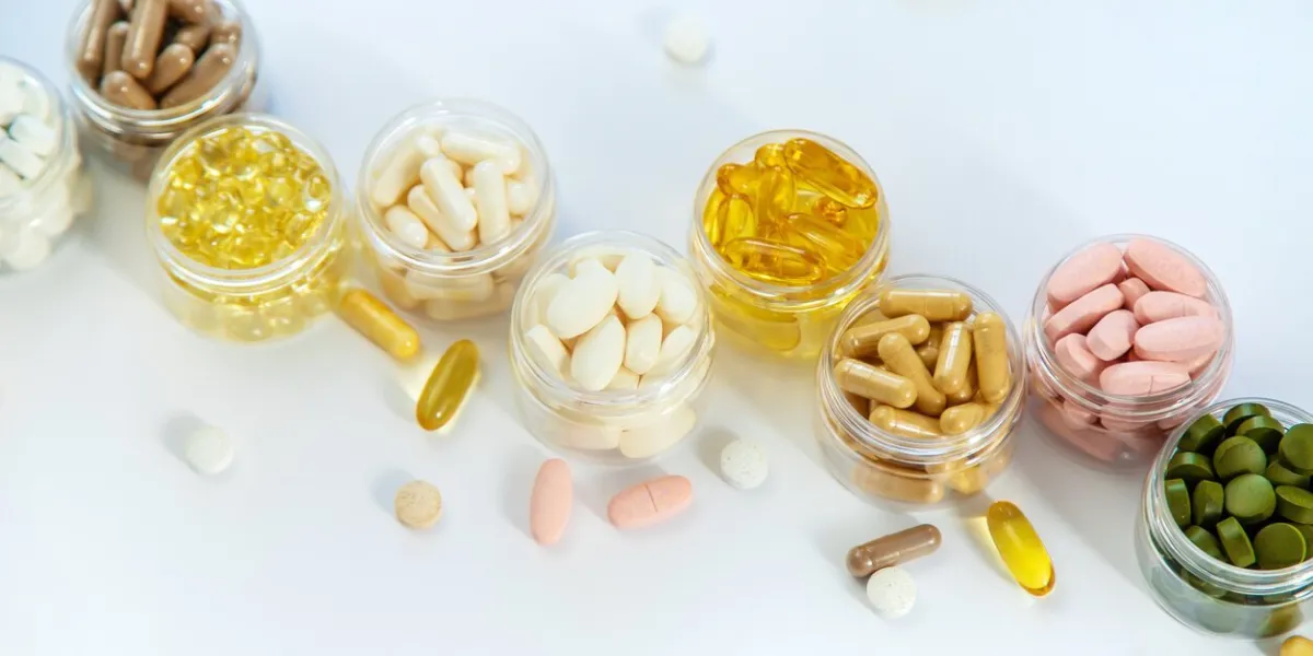 supplements and vitamins on a white background selective focus medicine