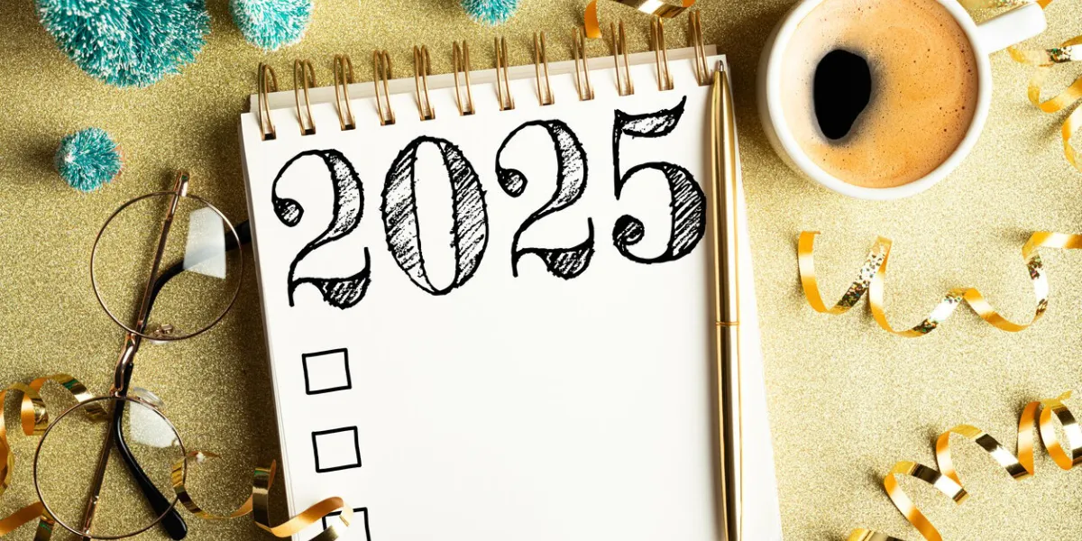 2025 new year resolutions on desk 2025 goals list with notebook, coffee cup, festive decorations on golden background resolutions, plan, goals, checklist, idea concept new year 2025 resolutions copy space