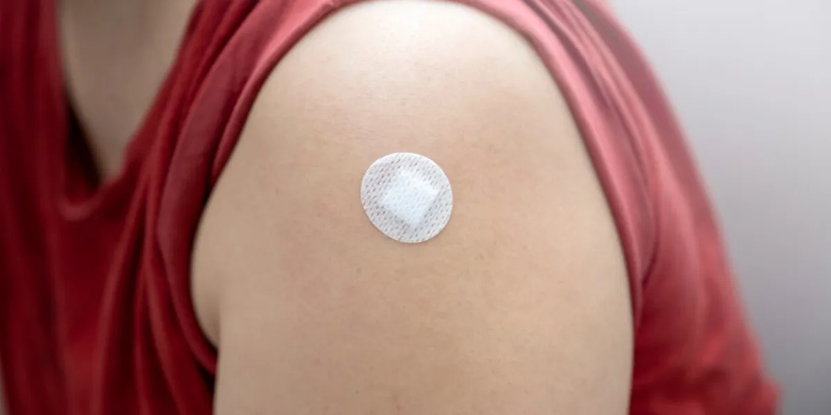 a person with a white bandage on their arm