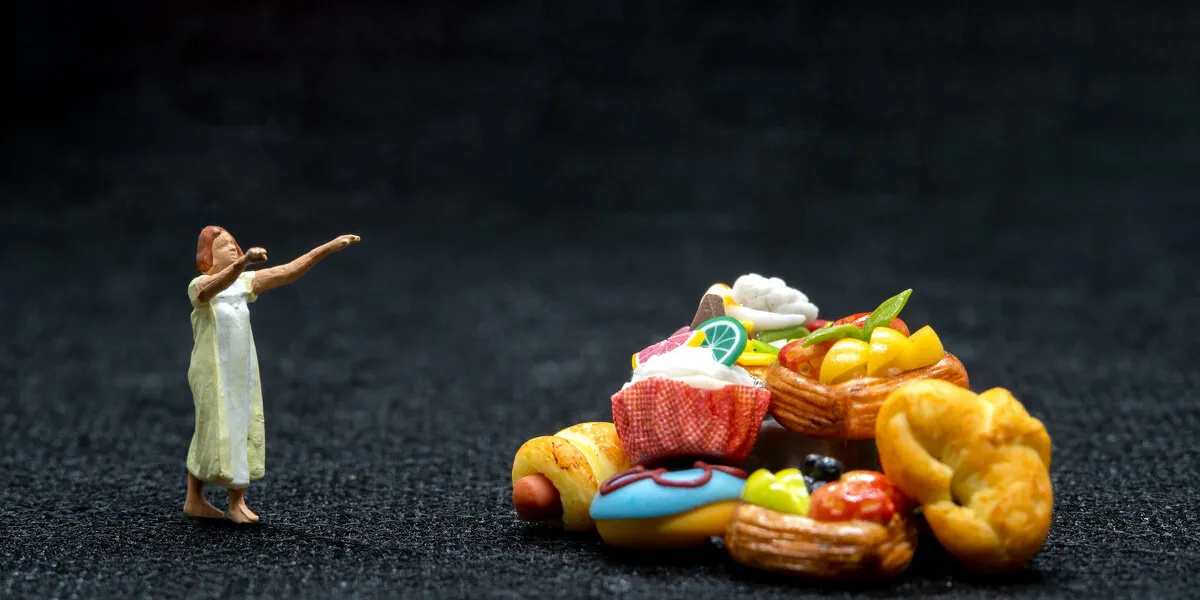 miniature people female sleepwalker in pajama dream about snack at night , unhealthy concept