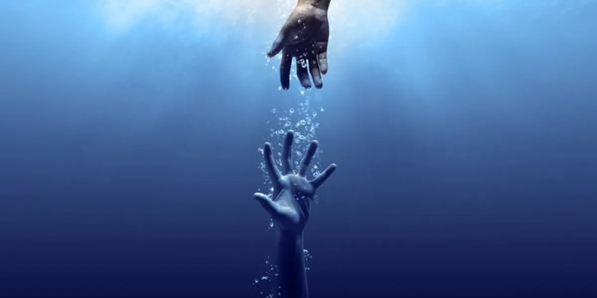 hand drown in the water looking for help