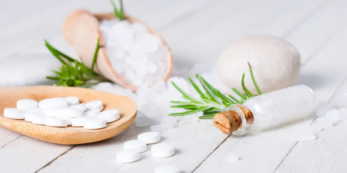 schuessler salts and salt crystal on white wood table
