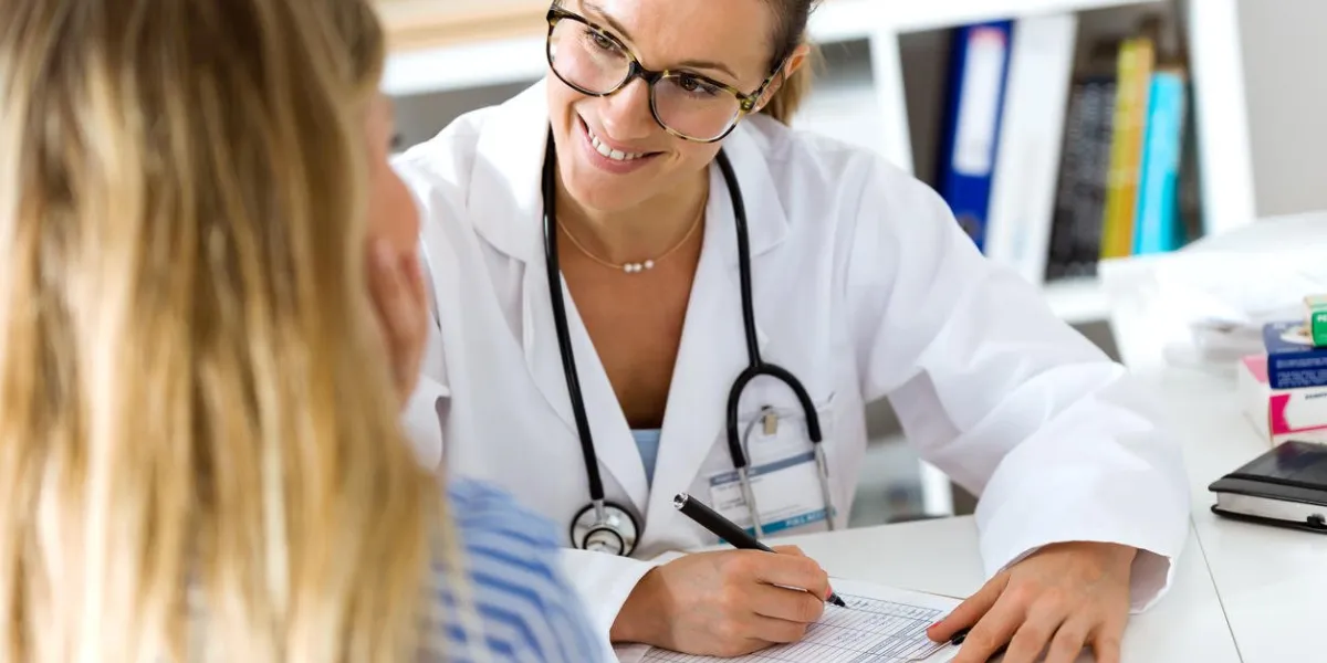 portrait of female doctor explaining diagnosis to her patient