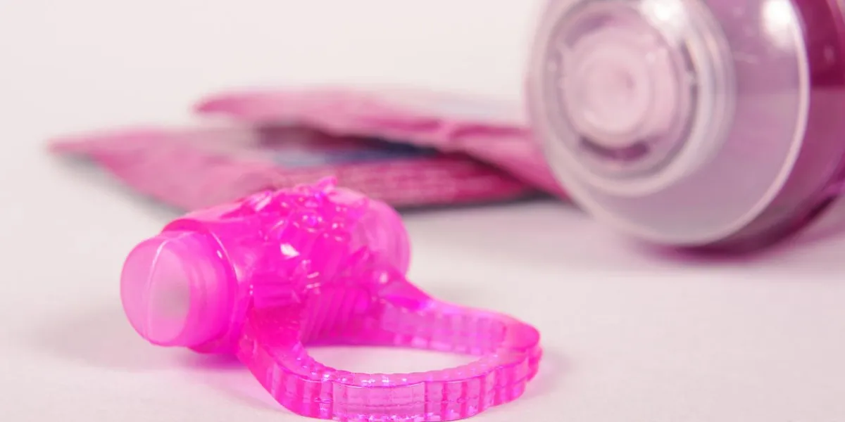 penis ring and condoms isolated on the white background